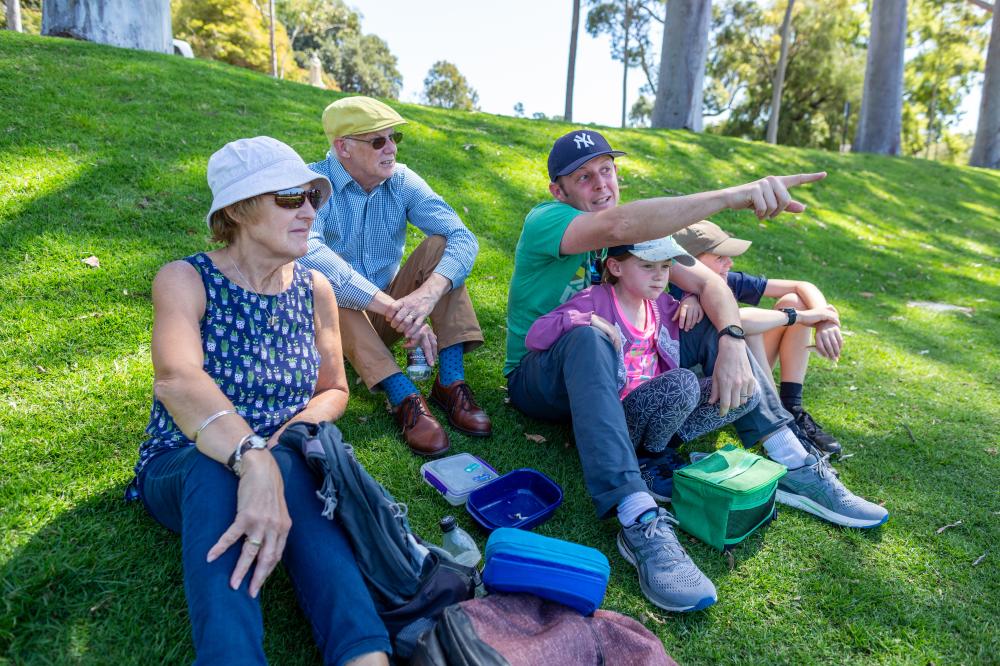 Fraser Avenue Precinct is a delight for families. Family sitting on the hill near Fraser Avenue.