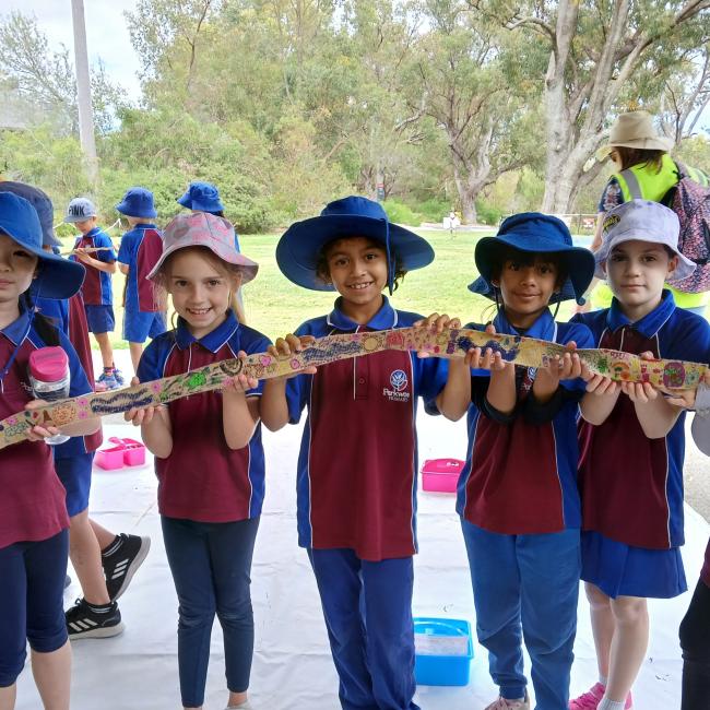 Students do tree wrap activity as part of Noongar Boodja's 2024 Birak Festival