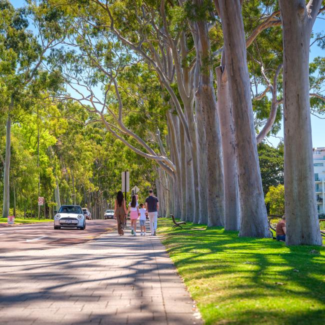 A family walking down Fraser Avenue.